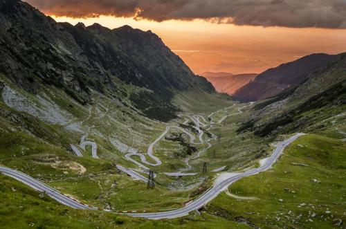a winding road on the side of a mountain at TheAttic in Corbeni