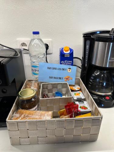 a tray of food sitting on a counter next to a coffee maker at Tinos dream sea ,150m from the beach in Agios Sostis