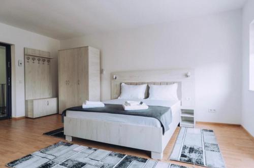 Katil atau katil-katil dalam bilik di Apartamente TRS