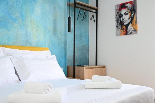 Кровать или кровати в номере EMAR Beachfront Hotel Ksamil