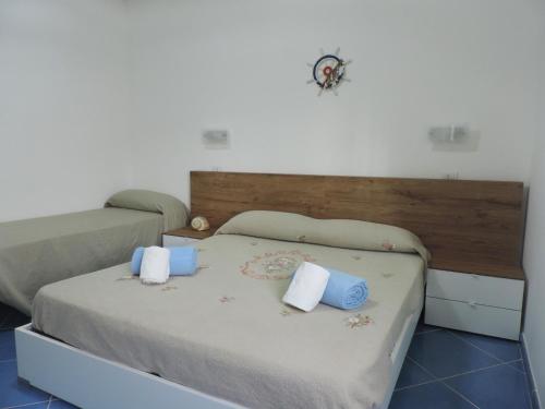 En eller flere senge i et værelse på Mediterraneo Rooms
