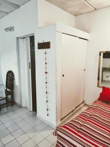 a bedroom with a bed and a closet at A&C Temporarios in Corrientes