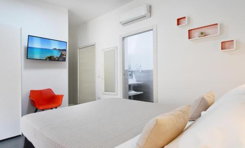 Un ou plusieurs lits dans un hébergement de l'établissement Elis b&b Villasimius