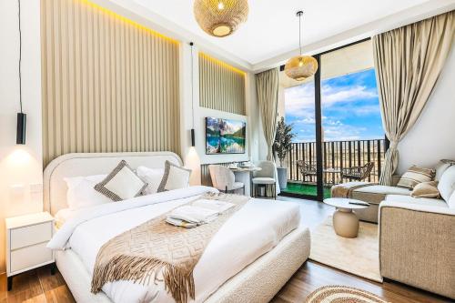 a bedroom with a bed and a living room at FIRST CLASS Studio Unwind in Style in Dubai