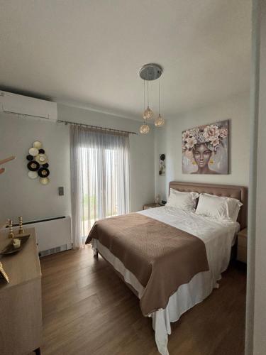 En eller flere senge i et værelse på Villa Dim