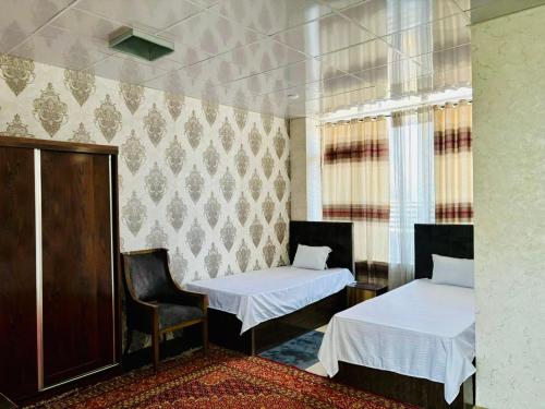 Postel nebo postele na pokoji v ubytování Rahat Hotel