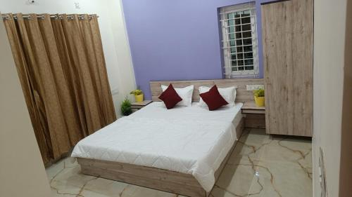 Ένα ή περισσότερα κρεβάτια σε δωμάτιο στο Eve Service apartment