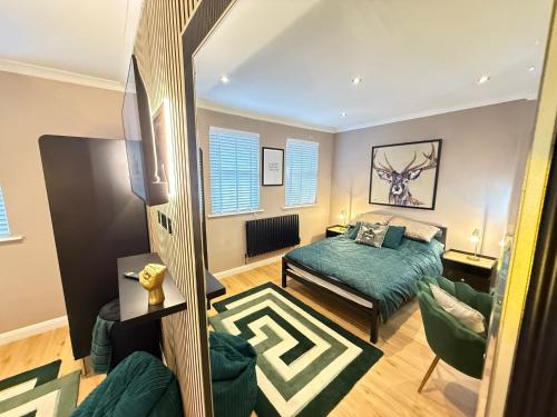 a living room with a bed and a couch at Modern House Maryport Sleeps 6 in Maryport