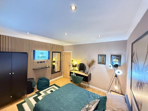 a bedroom with a bed and a desk in it at Modern House Maryport Sleeps 6 in Maryport