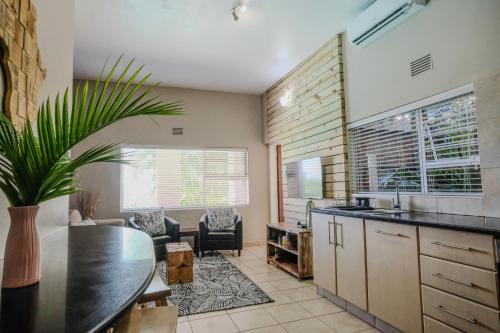 a kitchen with a sink and a counter top at Little Eden St Lucia in St Lucia