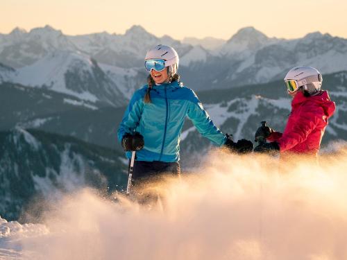 two people standing on top of a snow covered mountain at Studio Montagnard au Centre du Grand-Bornand, Proche Pistes et Bien-Être - FR-1-467-27 in Le Grand-Bornand