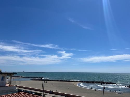 a view of a beach with the ocean at Casa Romano SeaFront in Fiumicino