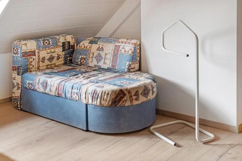 a small bed in a corner of a room at Altes Forsthaus - Fewo Bianca in Bad Peterstal-Griesbach