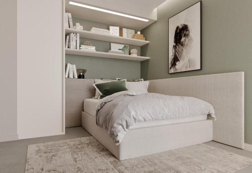 a bedroom with a bed in a room with shelves at Terrazza sul mare a Porto Cervo in Porto Cervo