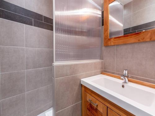 a bathroom with a sink and a mirror at Studio cabine 5 personnes avec balcon - La Plagne - FR-1-353-85 in Les Coches