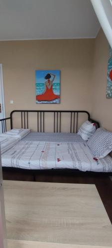 Ένα ή περισσότερα κρεβάτια σε δωμάτιο στο Sunrise Beach Apartment