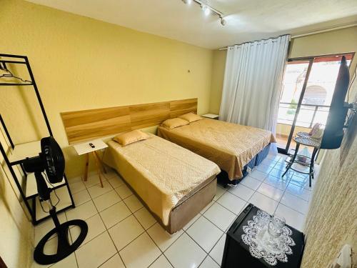 Postel nebo postele na pokoji v ubytování Suites Holanda