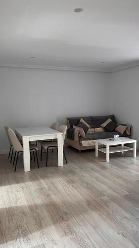 a living room with a couch and a table at vivienda turística Irún in Irún