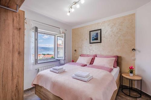 Postel nebo postele na pokoji v ubytování Apartments Rose