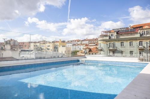 a swimming pool on the roof of a building at Casas da Baixa - Vila Intendente in Lisbon