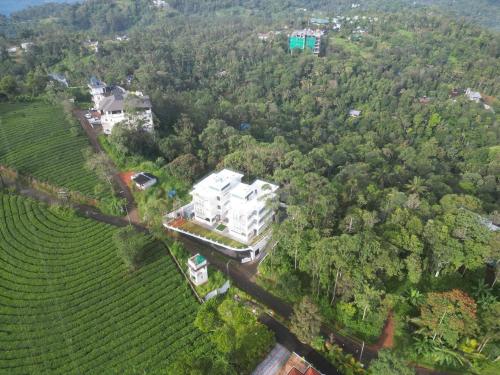 an aerial view of a house in a vineyard at Sunrise Munnar in Anachal