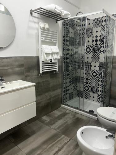 a bathroom with a shower and a toilet and a sink at Travel Home Pompei in Pompei