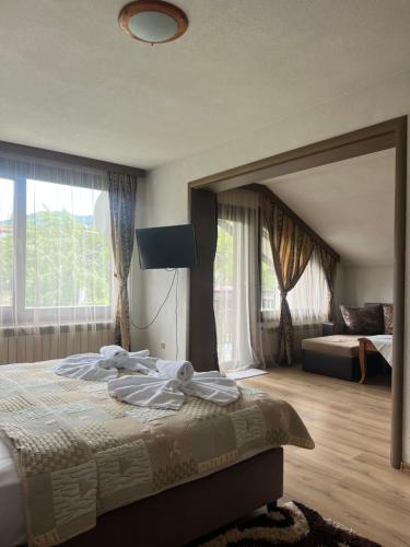 Postel nebo postele na pokoji v ubytování Guest House Raffe