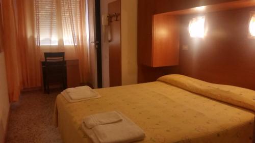 Ένα ή περισσότερα κρεβάτια σε δωμάτιο στο Hotel Pecci