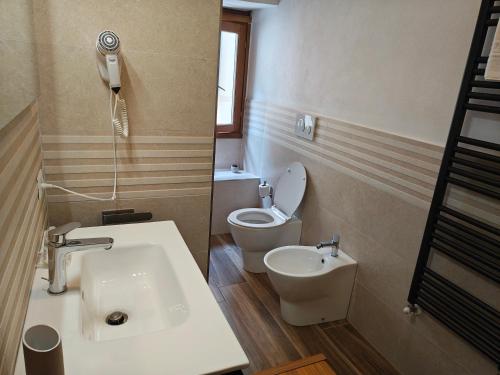 a bathroom with a sink and a toilet at Villa Torricelli Scarperia - Il Giardinetto Residence in Scarperia