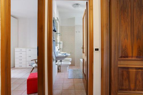 a bathroom with a toilet and a sink at Villino Flora a Viareggio in Viareggio