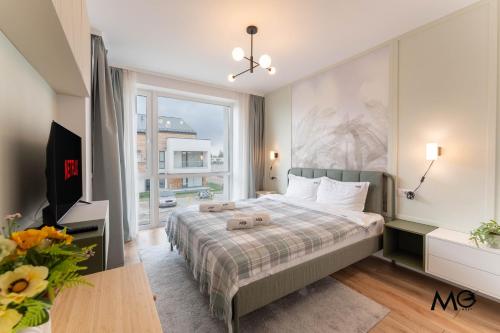 Ένα ή περισσότερα κρεβάτια σε δωμάτιο στο MoHost Uno - Elevated Stay with Mountain Views