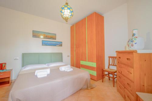 Ένα ή περισσότερα κρεβάτια σε δωμάτιο στο CasaZen, 2 camere, giardino e parking