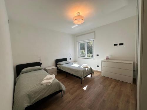 Ένα ή περισσότερα κρεβάτια σε δωμάτιο στο The Quiet Corner- Lake Como