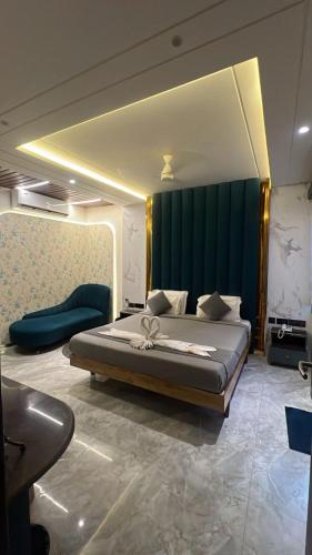 a bedroom with a large bed in a room at Hotel AK International - Chennai in Chennai