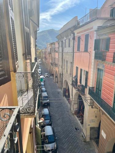 a city street with cars parked on the street at Casa Bel Tempo in Pieve di Teco