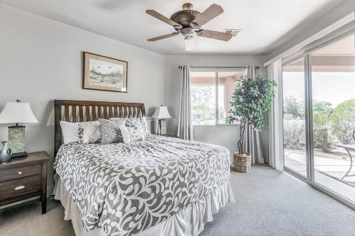 a bedroom with a bed and a ceiling fan at Santa Clara Sunrise in Santa Clara