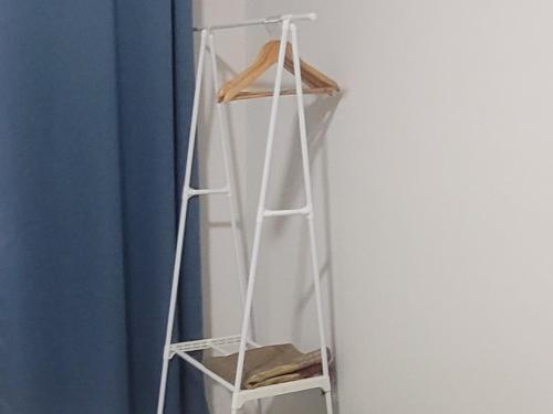 a ladder leaning against a wall in a room at Ana Homestay D'Airport in Melaka
