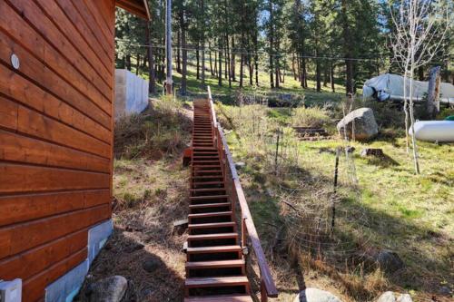 a set of stairs next to a house at Lakefront on Lake Shore in Joseph