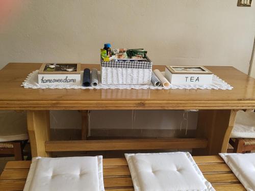 a wooden table with some items on top of it at Klunj home in Buje