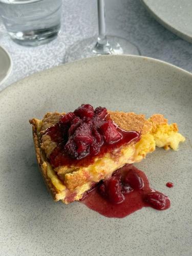 a slice of pie on a white plate at Kodra e Godenve in Vilë-Ballaj