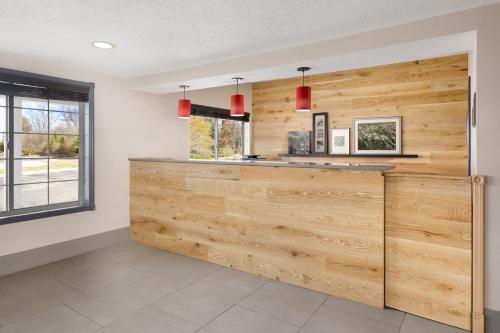 a kitchen with wood paneled walls and a counter at Country Inn & Suites by Radisson, Springfield, OH in Springfield