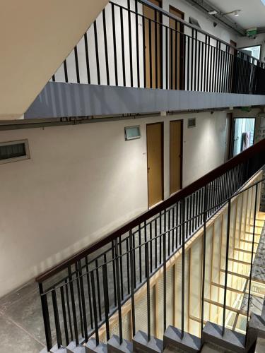 an overhead view of a stairway with doors in a building at jasminespace in Khlong San