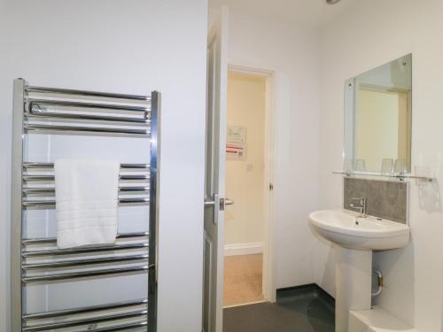 a bathroom with a sink and a toilet at The Devon Drift at Harcombe House in Newton Abbot