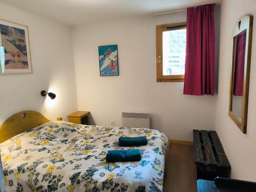 Ένα ή περισσότερα κρεβάτια σε δωμάτιο στο Bel Appartement lumineux au coeur de la station de Vars