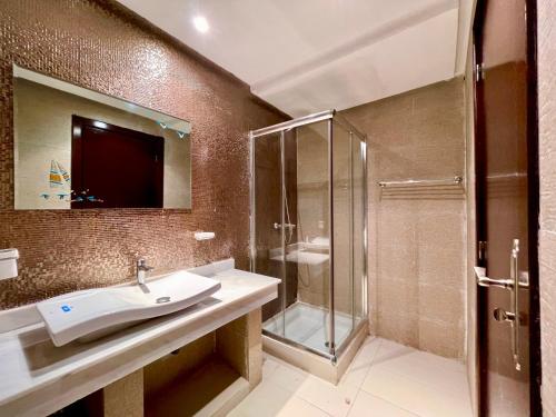 a bathroom with a sink and a shower at Family Home -2 in Agadir