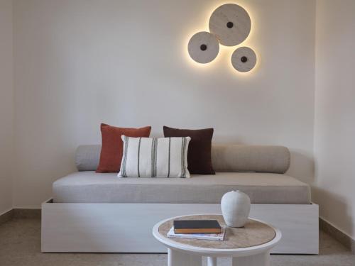 a living room with a couch and a table at Atlantica Thalassa Hotel in Kos Town