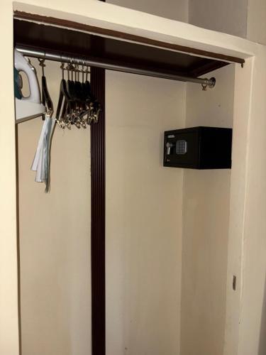 a sliding door in a room with a closet at FLORENCIA PLAZA HOTEL in Tegucigalpa