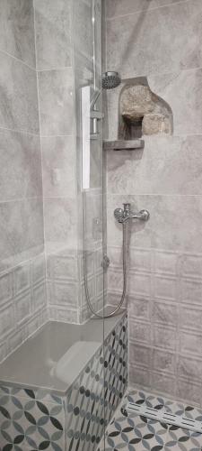 a bathroom with a shower with a glass door at Lorenzo Old Town in Dubrovnik