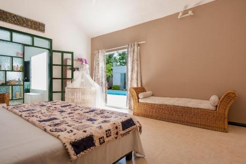 a bedroom with a bed and a window at Holiday Villa in Balaclava