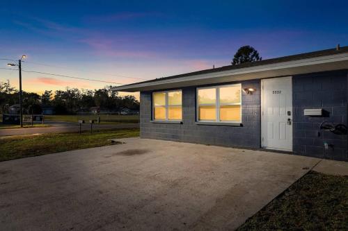 a building with a parking lot in front of it at Spacious Zephyrhills Duplex #1 in Zephyrhills